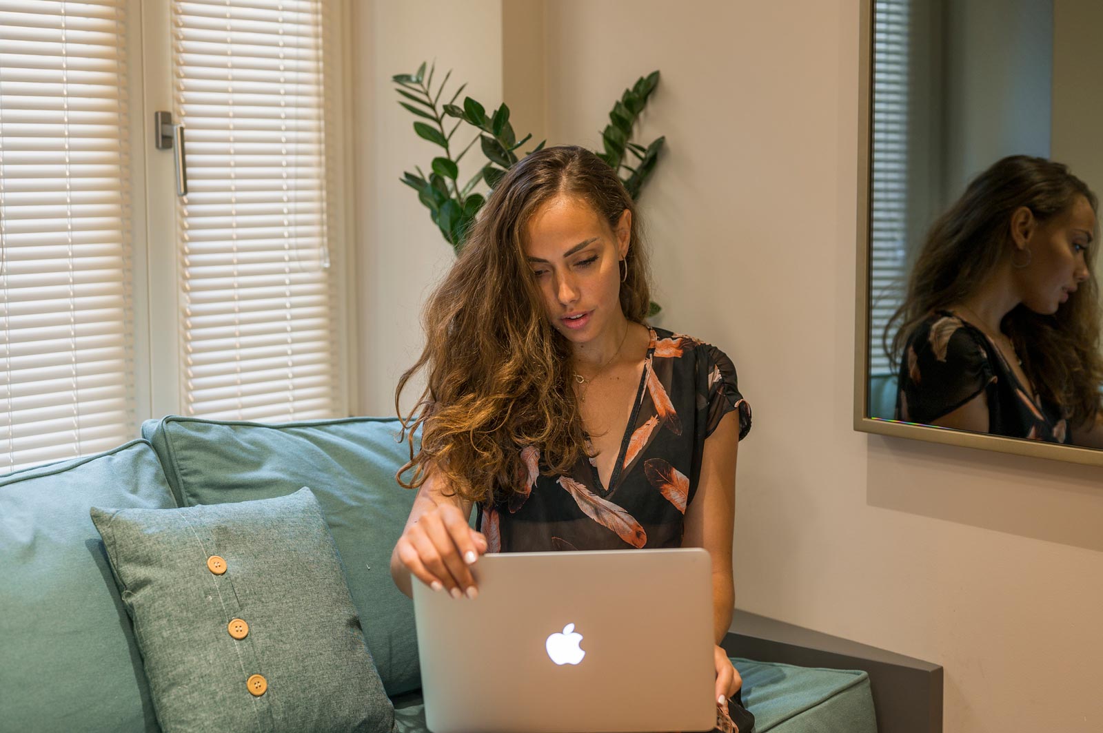 Woman with a laptop at suites interior